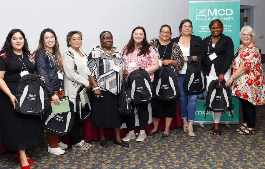 Community health worker trainees pose for a photo.