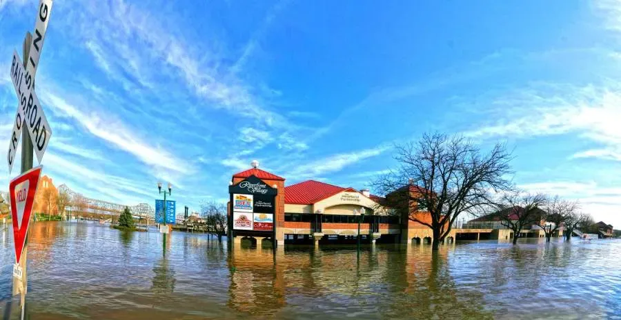 Floodwaters cover the parking lot of a mall in Peoria, Illinois.