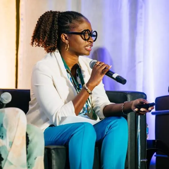 A public health experts speaks at the 2024 Open Forum conference.