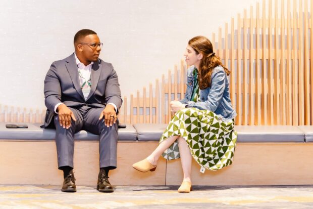 Two Reverse Site Visit attendees connect between sessions.