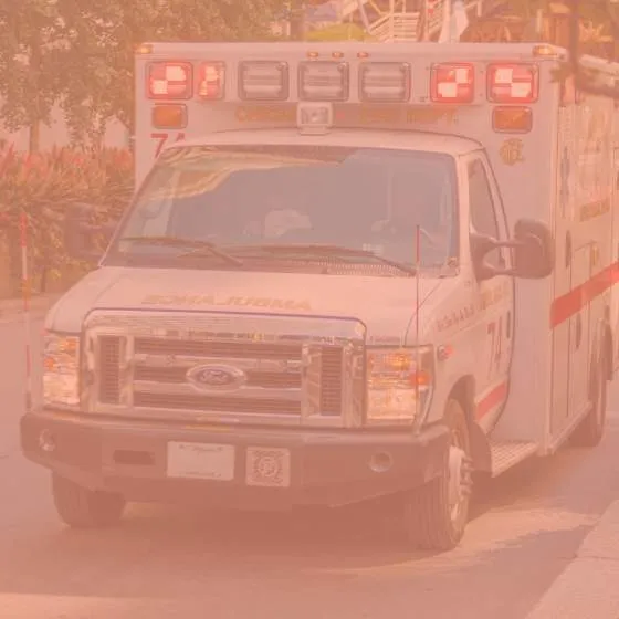 An ambulance driving down a street in Chicago.